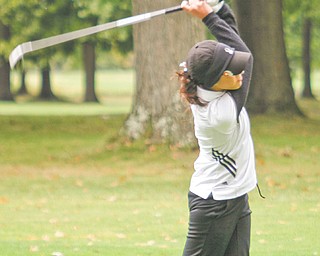 Canfield’s Christina Cooper tees off during the girls All-American Conference girls golf championship Wednesday
at Tamer Win Golf & Country Club in Bazetta Township. Cooper’s round of 85 led the Cardinals to the American
Division title and also earned her second place overall.
