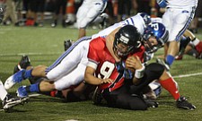 NICK MAYS l THE VINDICATOR (27) Anthony Kosec of Poland brings down (9) Kimu Kim of Canfield during the second quarter of thier game in Canfield Friday night. poland vs canfield 09212012 canfield, ohio