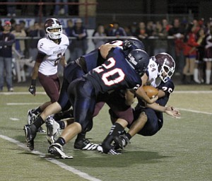 ROBERT  K.  YOSAY  | THE VINDICATOR --..SACK   -  #24 Bdm John Babos.. is  sacked in the second quarter by Ftichs #20  Jared McHenry -  #50  Ryan Sayers and #76  Tony Behanna..Boardman  vs Fitch @ Fitch   ..(AP Photo/The Vindicator, Robert K. Yosay)