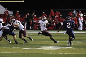 ROBERT  K.  YOSAY  | THE VINDICATOR --.. #1 Bdm Nathan Jones mmakes a cut on #2 Fitch KerrellJohnson  on his way for the only touchdown - Boardman  vs Fitch @ Fitch   ..(AP Photo/The Vindicator, Robert K. Yosay)