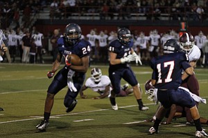 ROBERT  K.  YOSAY  | THE VINDICATOR --..Fitchs #24  Darrin Hall  moves off of Tackle for  a run to the endzone in first quarter action --#41  Andrew James and #17   Tyler Grover -  Looking up from the Turv #1 Boardman  Nathan Jones --Boardman  vs Fitch @ Fitch   ..(AP Photo/The Vindicator, Robert K. Yosay)