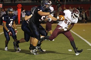 ROBERT  K.  YOSAY  | THE VINDICATOR --..Driven back Boardmans #21  Isiah Lyle is driven back by fitchs #54  Billy Price  and #50   Ryan Sayers  -- -Boardman  vs Fitch @ Fitch   ..(AP Photo/The Vindicator, Robert K. Yosay)