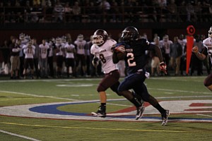 ROBERT  K.  YOSAY  | THE VINDICATOR --..Fitch #2   Kerrell Johnson is off to the races and almost a touchdown in the second quarter as Bdm #8  Ryan Savage gives chase -Boardman  vs Fitch @ Fitch   ..(AP Photo/The Vindicator, Robert K. Yosay)