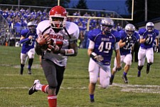 IMG 3398: Temeko Holness (10) of Struthers runs up the sideline after catching a pass during the second quarter of Friday nights matchup at Hubbard High School. ÊDustin Livesay Ê| ÊThe Vindicator Ê9/21/12 ÊHubbard, Ohio