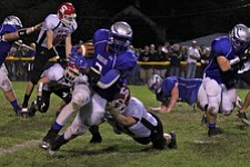 IMG 3544: LJ Scott (3) of Hubbard sheds the tackle of a Struthers defender duringÊFriday nights matchup at Hubbard High School. ÊDustin Livesay Ê| ÊThe Vindicator Ê9/21/12 ÊHubbard, Ohio