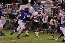 IMG 3575: Darnell Tate (1) of Hubbard outruns Tommy Kimbrough (6) of Struthers through an opening in the center of the field during the second halfÊof Friday nights matchup at Hubbard High School. ÊDustin Livesay Ê| ÊThe Vindicator Ê9/21/12 ÊHubbard, Ohio