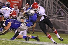 IMG 3724: Temeko Holness (10) of Struthers sacks hubbard quarterback Brandon Harb (12) during the second halfÊof Friday nights matchup at Hubbard High School. ÊDustin Livesay Ê| ÊThe Vindicator Ê9/21/12 ÊHubbard, Ohio