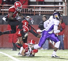 Willim D. Lewis the Vindicator   UNI's Terrell Sinkfield eludes YSU  defense to score during 1rst qtr. 