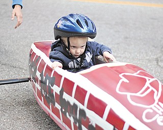 Garrett Teutsch, 2, of Girard rides in a soap-box derby car during the second annual Silly Science Sunday at the OH WOW! The Roger & Gloria Jones Children’s Center for Science & Technology in Youngstown. The event featured a variety of science-related activities.