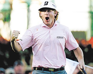 Brandt Snedeker lets out a yell after sinking his putt on the 18th hole to win the PGA Tour Championship and FedEx Cup on Sunday in Atlanta.