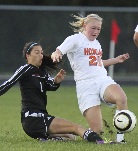 William D.Lewis The Vindicator  Canfield's Lauren Pettola (11) and Howland's Morgan Scott (28) go for the ball during Monday action at Howland.