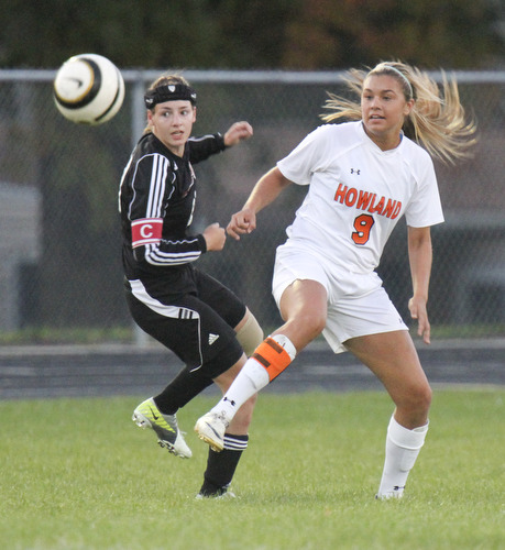 William D.Lewis The Vindicator  Canfield's Jen Morris(23) and) and Howland's Seyla Perez(9) go for the ball during Monday action at Howland.