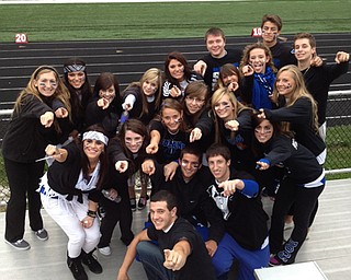 Poland High School Senior Dog Pound members cheer on the boys as they take on Canfield.
