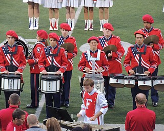 Drumline performs a percussion piece during pregame
