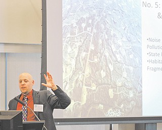 Trent Dougherty, chief legal analyst for the Ohio Environmental Council, stands before a group of journalists Thursday to explain the complexities of the oil and gas industry.
