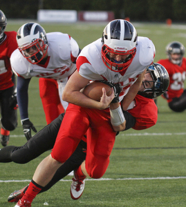ROBERT  K.  YOSAY  | THE VINDICATOR --..#11 Niles John Cicero  goes into the Endzone draggin  Canfields #84 Kyle Nagy - as Niles scored in the first set of downs -.Niles at Canfield - Bob Dove Field ..(AP Photo/The Vindicator, Robert K. Yosay)