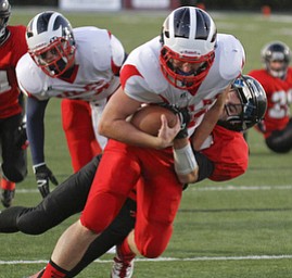 ROBERT K. YOSAY | THE VINDICATOR --..#11 Niles John Cicero goes into the Endzone draggin Canfields #84 Kyle Nagy - as Niles scored in the first set of downs -.Niles at Canfield - Bob Dove Field ..(AP Photo/The Vindicator, Robert K. Yosay)
