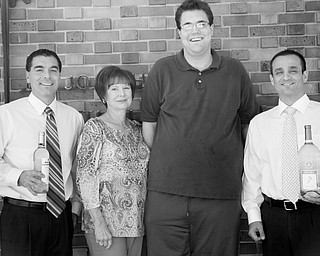 From left to right are Dan Memo, Geri Kosar, Brian Forward and John Beato, committee members for the Napa Valley to the Mahoning Valley fundraiser to benefit the Rich Center for Autism. The fundraiser will take place Nov. 9 at Our Lady of Mount Carmel Church Hall. PHOTO BY: MADELYN P. HASTINGS | THE VINDICATOR