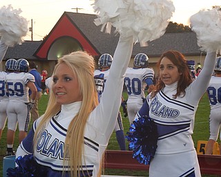 Seniors Kelsey Gill and Alyssa Carline cheer on their Poland Bulldogs during the Poland/Struthers game