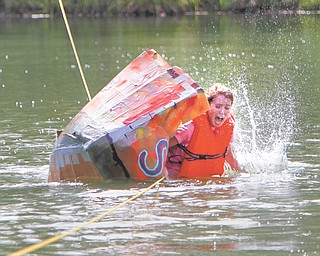 South Range sophomore Mary Clare McCarthy and her safari-themed team are doing their best to capture the Titanic award for best unintentional sink at the 15th annual Raider Regatta on Monday. The boats were made using cardboard and duct tape.