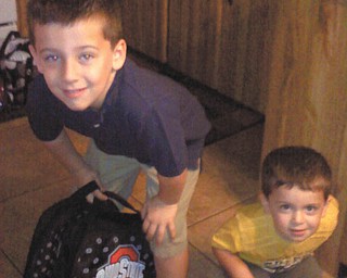 Judy Wilson of Struthers sent this picture of the two loves of her life, grandsons Vincent Boila, 5, who is heading to his first day of kindergraten at Lowellville Schools, and Patrick Boila, 2, on his way to the first day of day care.