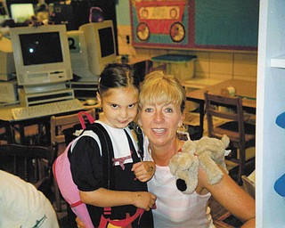 Melissa Pregi sent this picture of her, daughter, Liana, with her teacher, Mrs. Nadzam, on her first day in kindergarten at West Boulevard in Boardman in September 2003.