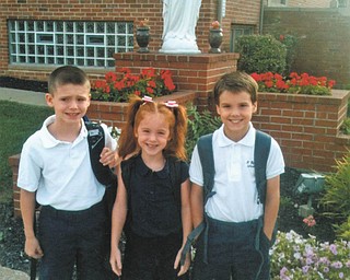 Theresa and Kevin Murphy of Bazetta sent this picture of the first day of school at St. Rose School in Girard for their children. Aidan is a fourth-grader, Alyse is a first-grader, and Liam is a second grader.