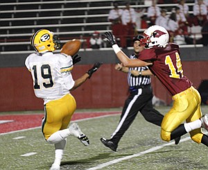 ROBERT K. YOSAY | THE VINDICATOR..St Eds #19....Anthony Young. pulls in a touchdown pass as Mooneys #14 Marcus Penza looks on - during first quarter action -..Lakewood St Edwards vs Cardinal Mooney at Stambaugh Stadium at YSU -... - -30-..