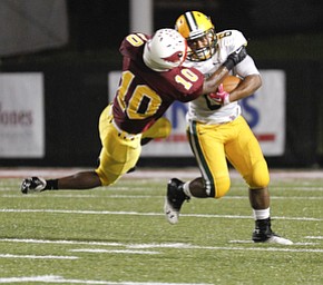 ROBERT K. YOSAY | THE VINDICATOR..St Ed's # 6 .... Dwayne Aaron ... just pushes off Mooneys #10 Justus Ellis- Moore as her runs for a first down during first quarter action at Mooney..Lakewood St Edwards vs Cardinal Mooney at Stambaugh Stadium at YSU -... - -30-..
