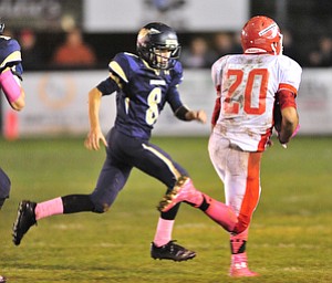 Brookfield's #8 Kasey Tingler chases down Edgewood ball carrier #20 Dylan McCaleb after he reached the open field.