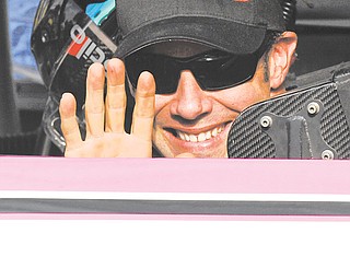 Matt Kenseth waves from his car in Victory Lane after winning Sunday’s NASCAR Sprint Cup race at Talladega
Superspeedway in Talladega, Ala.