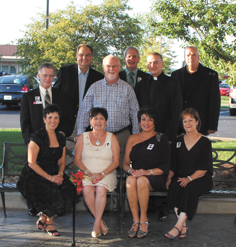 The 50th class reunion of Cardinal Mooney High School Class of 1962 was celebrated Aug. 18 at Holiday Inn, Boardman. The planning committee members were: seated, from left, Audrea Marsch Neri, chairwoman; Ginger Leone Kubala, Yvonne Joseph Marzano and Maureen Reese Krull. Standing are John Mulchay, Jim Loppata, principal John Young, Rip Repasky, the Rev.  Gerald DeLucia, president, and Danny Rhattigan. There was also a party Friday evening at Johnny’s Restaurant. Over 150 attended the events. Special guests included the new president, Father DeLucia, and Principal Young. A foreign exchange student, Fabio Marchetti, also attended and traveled from Trieste, Italy. The class donated more than $1,700 for restoration of the courtyard including the painting of the Virgin Mary.