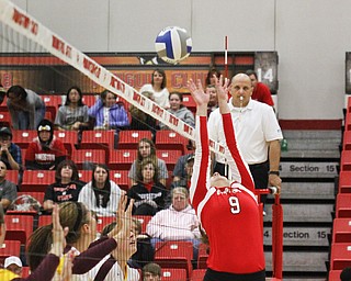 MADELYN P. HASTINGS | THE VINDICATOR

Erin Muir sets the ball over the net during the YSU Loyola game.
