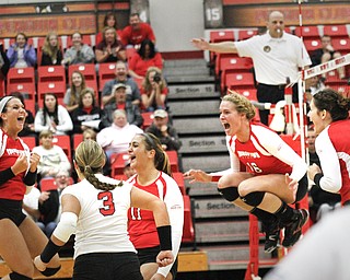 MADELYN P. HASTINGS | THE VINDICATOR

The girls celebrate after they score a point during the YSU Loyola game.