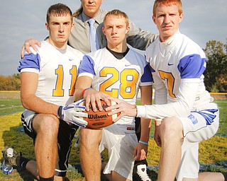 MADELYN P. HASTINGS | THE VINDICATOR
(L-R) Jared Shilot, coach Mike Skrinjar, JJ Napierkowski, and Luke Griffith pose for a portrait on their field at Southern Local High School.