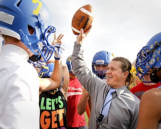 MADELYN P. HASTINGS | THE VINDICATOR
Southern Local High School football coach Mike Skrinjar cheers on the team after practice on October 4, 2012.