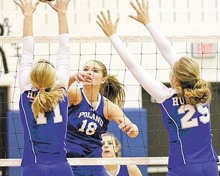 Poland’s Aleah Hughes (18) shoots past Hubbard’s Maris Sarisky (11) and Caitlin O’Hara (25) during Thursday action at Poland.