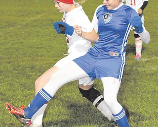 Lakeview’s Allison Pavlik (9) battles LaBrae’s Laura Hall (5) during a recent game at LaBrae. Not only has Pavlik
helped the Bulldogs to a No. 3 seed in the upcoming Division II district tournament, but the junior has accumulated 90 goals and 12 assists over the last three years, including 34 goals this season alone.