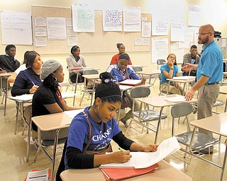 Juniors and seniors at Chaney Visual and Performing Arts and Science, Technology, Engineering and Mathematics School work in Chris Patrone’s government class. Chaney moved to an effective designation, up from academic watch, on the preliminary state report card released Wednesday.