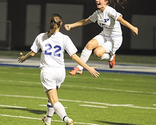 Poland’s Victoria Harger (15) and Rachael Robertson (22) celebrate Harger’s first goal in Wednesday’s Division II sectional semifinal soccer match against Cardinal Mooney in Poland. The Bulldogs shut out the Cardinals, 3-0, to advance to the final.