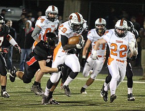 NICK MAYS l THE VINDICATOR (29) Jaquore Marrs of Howland tries to break the tackle attempt of (5)John Dellick during the first quarter Friday night in Canfield. howland vs canfield 10192012 Canfield, Ohio