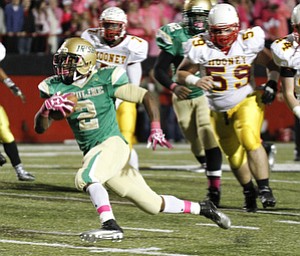ROBERT K. YOSAY | THE VINDICATOR..Second quarter action as Ursulines #2 Tramain Thigpen breaks away for a first down behind him is #7 Marlan Everson and #59 Nick Bilas ..Mooney @ Ursuline YSU Stadium - Ursuline won 44-24 -... - -30-..