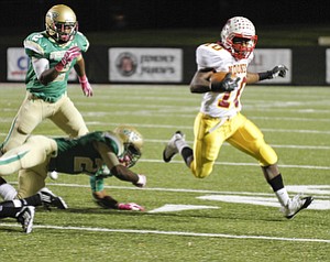 ROBERT K. YOSAY | THE VINDICATOR.. Mooneys #10 Justus Ellis Moore makes the cut and beats out Ursuline #26 Marcus Mosley and # 2 Tramain Thigpen - ..Mooney @ Ursuline YSU Stadium - Ursuline won 44-24 -... - -30-..