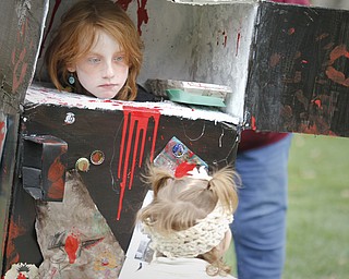 MADELYN P. HASTINGS | THE VINDICATOR
Madiosn Gatto, 8, attempts to scare her younger sister, Gracie Gatto, 2, both of Berlin Center, by popping out of her bizarre refrigerator costume at the Spooktacular Funfest in Millcreek Park on October 20, 2012.