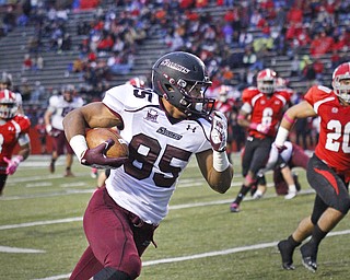 MADELYN P. HASTINGS | THE VINDICATOR
SIU's MyCole Pruitt runs pass YSU players Teven Williams, Travis Williams and Dom Rich with the ball during the YSU/SIU game on October 20, 2012.