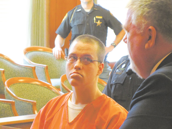 Felicia Beemer listens to her attorney, John Fowler, during her hearing on Wednesday in Trumbull County Common Pleas Court.