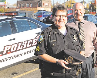 Lt. Rosemary Marsco of the Youngstown State University Police Department is the first woman in the department to rise to that rank. Chief John Beshara, right, promoted Marsco, who started with the department as a part-time
dispatcher 27 years ago.