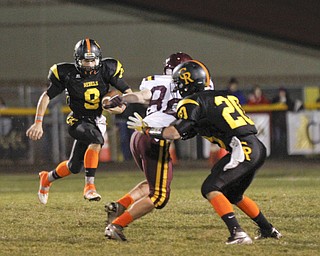 ROBERT K. YOSAY | THE VINDICATOR --..Heading out of the backfield as he rambles for a first down is Crestview #9 Collin Gilbert - Watching him is SouthRange Jake Pfeifer and Crestview #20 Kris Simpson puts a block.. -#9 made a cut for the first down - First Quarter..South Range at Crestview ..(AP Photo/The Vindicator, Robert K. Yosay)