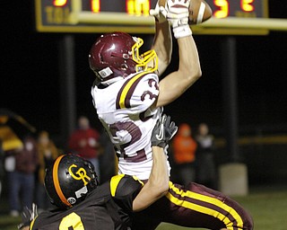 ROBERT K. YOSAY | THE VINDICATOR --..South Range #32 Robert Seman jumps high for A TD pass above Crestview #2 Trevor Cope... during ....second quarter.South Range at Crestview ..(AP Photo/The Vindicator, Robert K. Yosay)