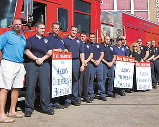 Members of the Youngstown Fire Department will be among nearly 10 fire companies that will be collecting donations at various locations Saturday to kick off Handel’s Ice Cream’s Koins for Kids campaign to raise money for Akron Children’s Hospital Mahoning Valley. Their goal is to collect $100,000.